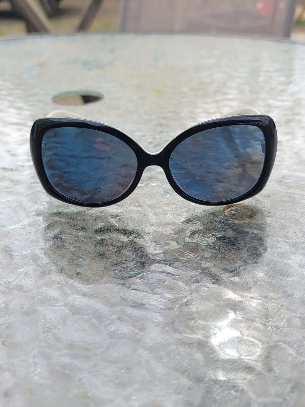 Costa Women's Black Frame Sunglasses with Blue Mirrored Lenses